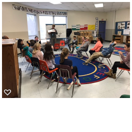 Mr. Charles is busy teaching rhythm decoding to his class 